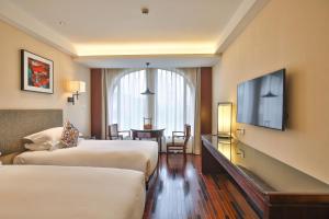 Postel nebo postele na pokoji v ubytování SSAW Boutique Hotel Shanghai Hongkou