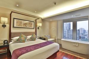 Postel nebo postele na pokoji v ubytování SSAW Boutique Hotel Shanghai Hongkou