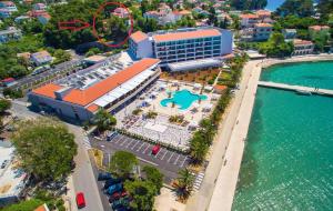 an aerial view of a resort and the water at Apartment and Rooms Milak in Rab