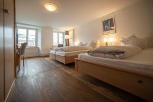 Voodi või voodid majutusasutuse Hotel Mokka Laufenburg toas