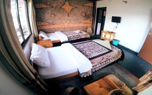 A bed or beds in a room at Hotel Hakoniwa
