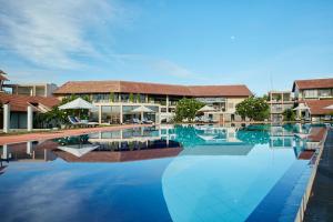 a rendering of a swimming pool at a resort at The Calm Resort & Spa in Pasikuda