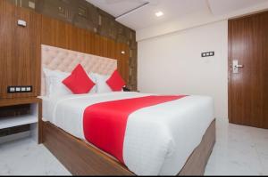 Postel nebo postele na pokoji v ubytování Hotel Arma Residency