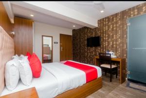 Postel nebo postele na pokoji v ubytování Hotel Arma Residency