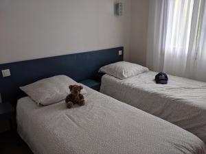 Un pat sau paturi într-o cameră la T3 pays du piment d'Espelette