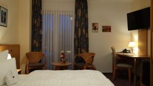 מיטה או מיטות בחדר ב-Hotel "Zur Post"