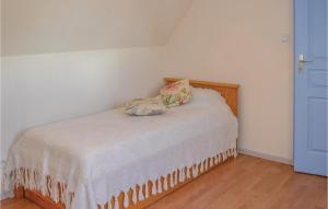 a small bedroom with a bed with a pillow on it at Three-Bedroom Holiday Home In Montfaucon in Montfaucon +6 photos