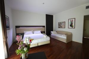 Postel nebo postele na pokoji v ubytování Grande Albergo Maugeri