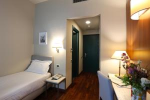 Postel nebo postele na pokoji v ubytování Grande Albergo Maugeri
