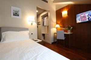 Postel nebo postele na pokoji v ubytování Grande Albergo Maugeri