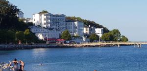 a group of people on the beach in the water at Apartment Villa Zur Altstadt Sassnitz in Sassnitz