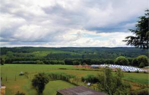 a view of a field with a farm in the distance at 2 Bedroom Stunning Apartment In Meisburg in Meisburg