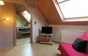 a living room with a flat screen tv in a room with a window at 2 Bedroom Stunning Apartment In Meisburg in Meisburg