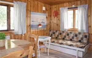 a living room with a bench and a table at Two-Bedroom Holiday Home In Skummeslov in SkummeslÃ¶v