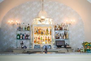 a bar with a lot of bottles of alcohol at Hotel Marina Riviera in Amalfi