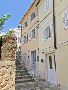 a stairway leading up to a building at House Romeo in Piran