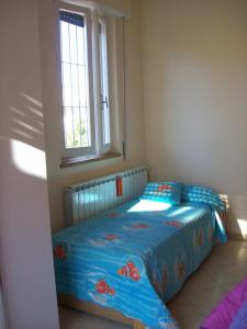 מיטה או מיטות בחדר ב-Il Mirto