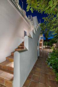 a set of stairs leading up to a house at Astra Studios in Astypalaia Town