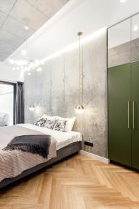 A bed or beds in a room at 2 Bedr 2 Bath Apartament by Reside Baltic