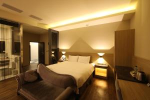 Postel nebo postele na pokoji v ubytování Yu Chun Hotel
