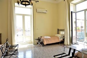 Posteľ alebo postele v izbe v ubytovaní B&B al Teatro Massimo