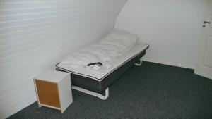 a small bed sitting in a room with at Sædding Strandvej (ID 119) in Esbjerg