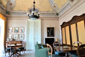 a living room with a table and a dining room at B&B al Teatro Massimo in Catania