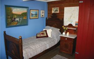 a bedroom with a bed and a map on the wall at Holiday Home Åmli Gjøvdal in Støylen +7 photos