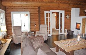 a living room with a couch and chairs and a table at Awesome Home In Hovet With House A Mountain View in Skoro