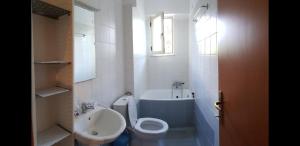 Koupelna v ubytování MPOZA APPARTMENTS