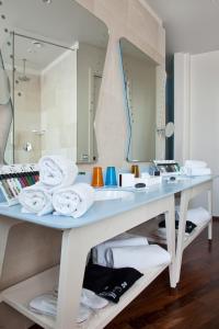 a bathroom with a sink and a mirror at iH Grande Albergo Delle Nazioni in Bari