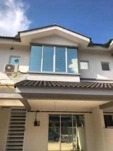 a house with a large window on the front of it at De Little Cabin - 7mins to Sunway Iost World of Tambun in Ipoh