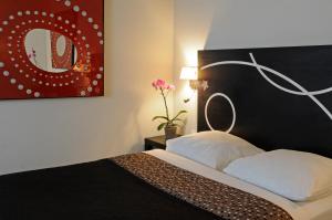Cama o camas de una habitación en Le Carmin by Popinns