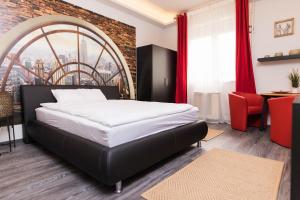 Кровать или кровати в номере NeroRosso Apartment
