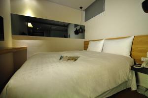 Letto o letti in una camera di Forward Suites II