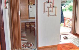 a kitchen with a door leading into a room at Holiday Home Graninge Boviken Töcksfors in Navarsviken