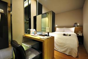 Letto o letti in una camera di Forward Suites II