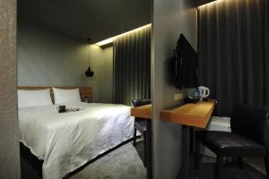 Letto o letti in una camera di Forward Suites II