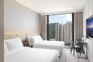 Giường trong phòng chung tại ALVA HOTEL BY ROYAL