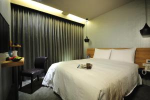Letto o letti in una camera di Forward Suites II