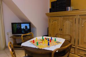 TV a/nebo společenská místnost v ubytování Gästehaus Heitkamp