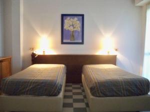 Кровать или кровати в номере Airone RTA