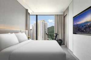 Giường trong phòng chung tại ALVA HOTEL BY ROYAL