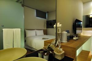 Letto o letti in una camera di Forward Suites II