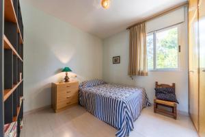 Llit o llits en una habitació de Villa vacaciones Benicassim
