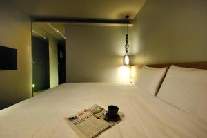 Letto o letti in una camera di Forward Suites II