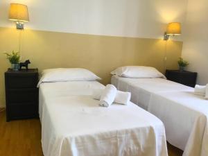 A bed or beds in a room at San Firenze Apartment