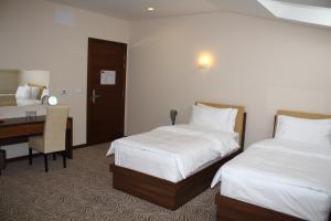 A bed or beds in a room at Hotel Franca