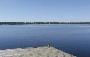 a wooden dock on a large body of water at Beautiful Home In Bolmsö With Wifi in Bolmsö