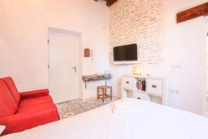 A kitchen or kitchenette at Corazón de Triana. Loft estiloso y confortable.